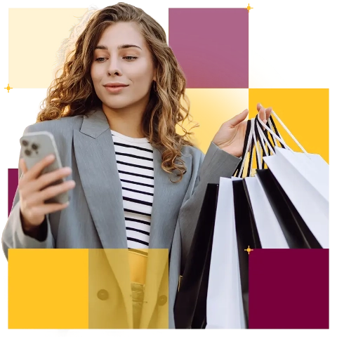 Kobieta z zakupami, dokonująca płatności przez telefon. 