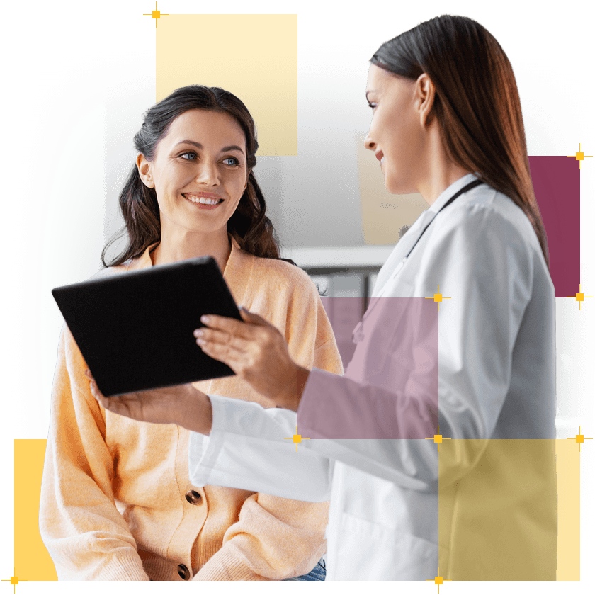 grafika przedstawiająca dwie kobiety, z których jedna prezentuje drugiej informację znajdującą się na tablecie